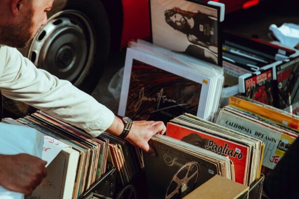 person holding vinyl records