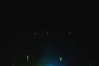 people standing on stage during nighttime