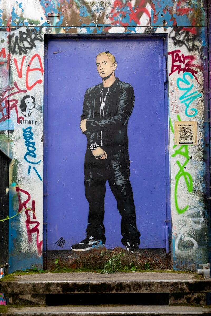 A painting of a man in a black suit