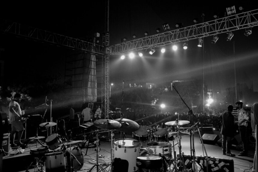 Captivating black and white image of a live concert stage setup at night in Ahmedabad, India.